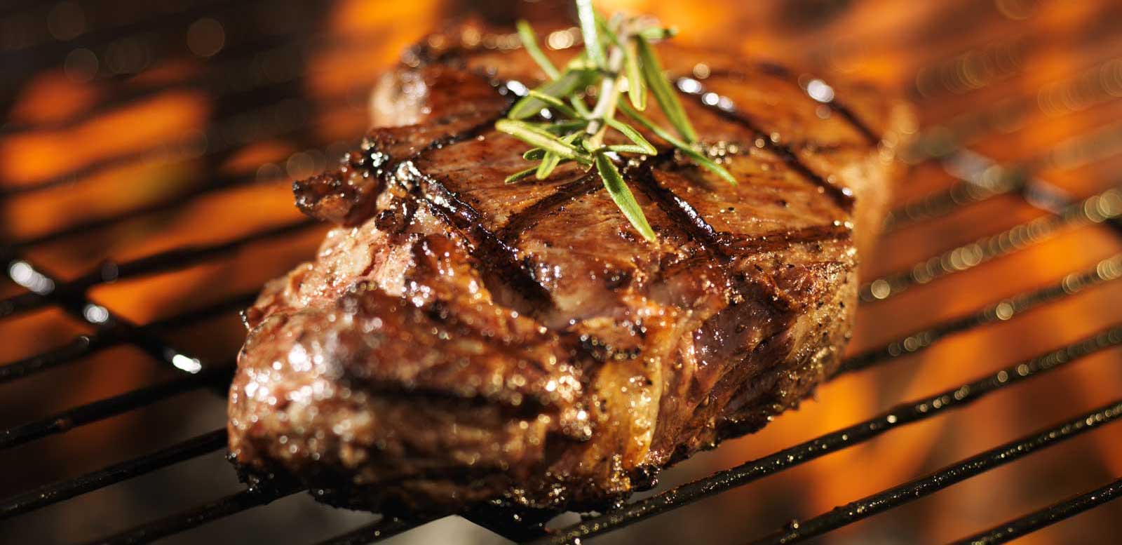 Steak cooking on grill